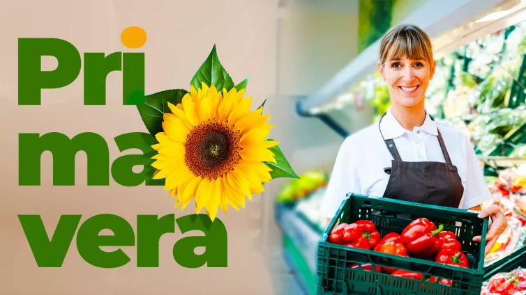 Funcionária de supermercado sorrindo e segurando caixa com pimentões frescos, ao lado da palavra “Primavera” com girassol decorativo, representando a campanha Primavera no Varejo: Torne sua Loja Mais Atrativa.